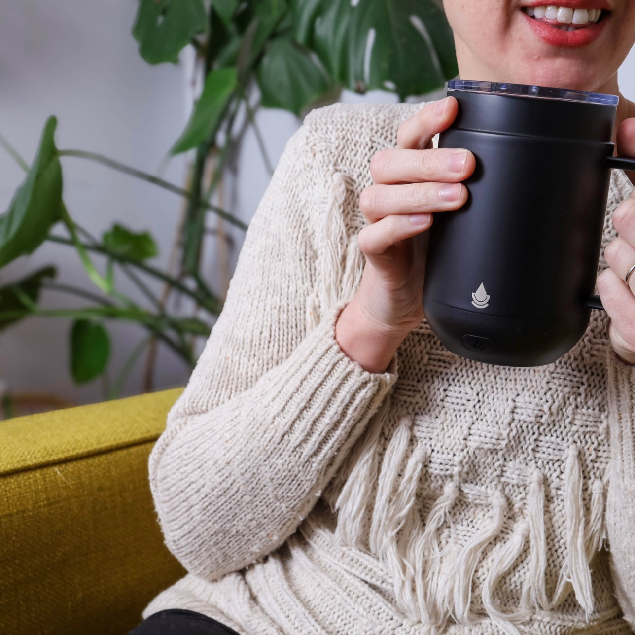 Woman holding the Ciups® Mug 16oz in her hands